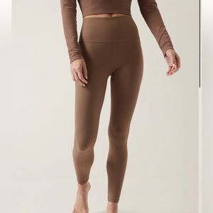 Athleta Salutation Stash Tight Sz S color Rustic Beige like new!